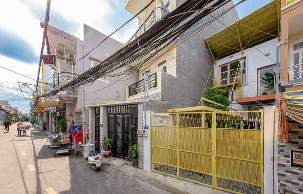 Double Roof House by Khoun Studio cc Thiet Vu streetscape