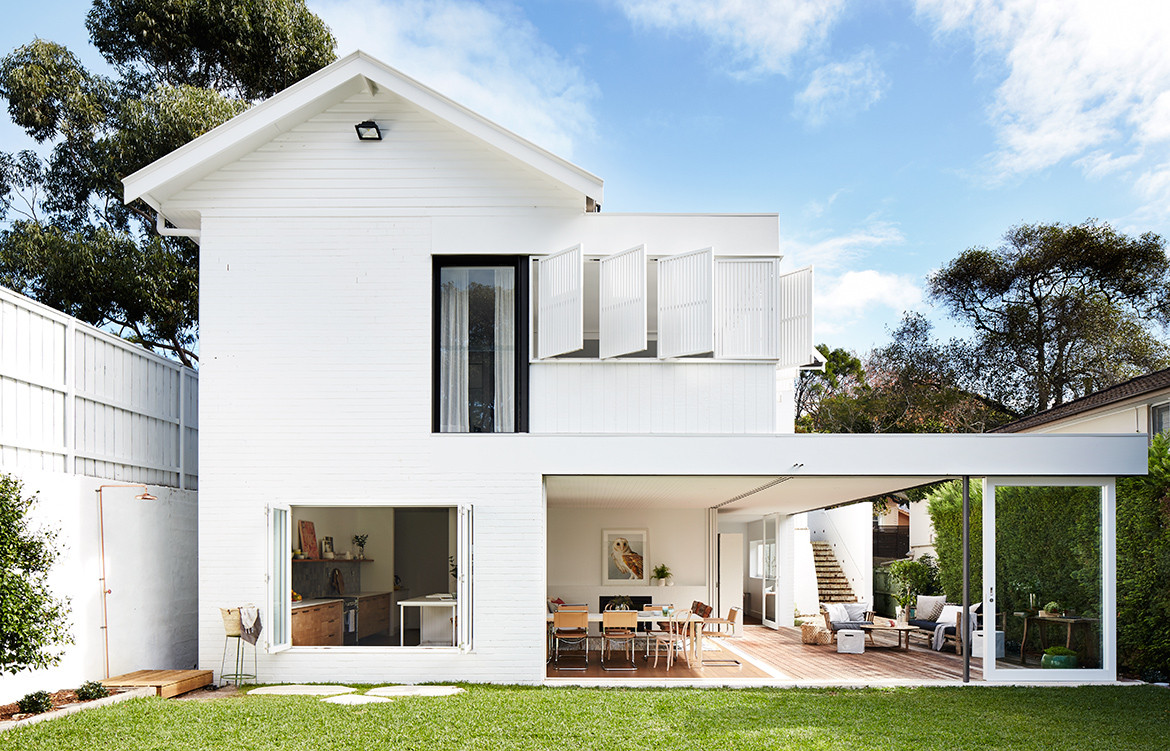 Mosman House by Alexander and Co. is a contemporary garden pavilion addition to a quaint cottage house.