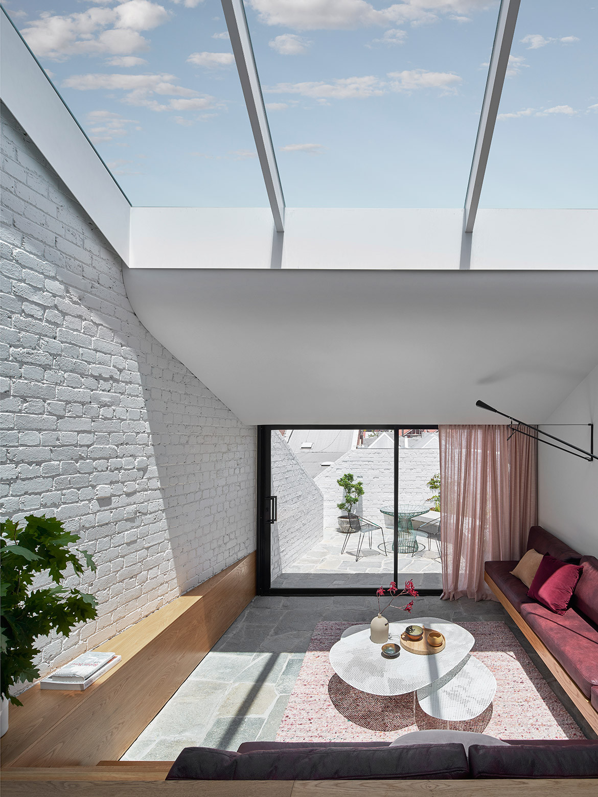 In order to make the most of this Melbourne residence’s blessed northerly aspect, Taylor Knights literally flipped the traditional layout of Fitzroy Terrace on its head.