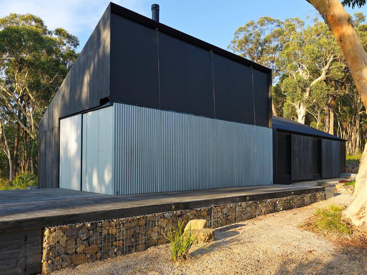 Exterior of Off Grid House when the fireproof shutters are closed.