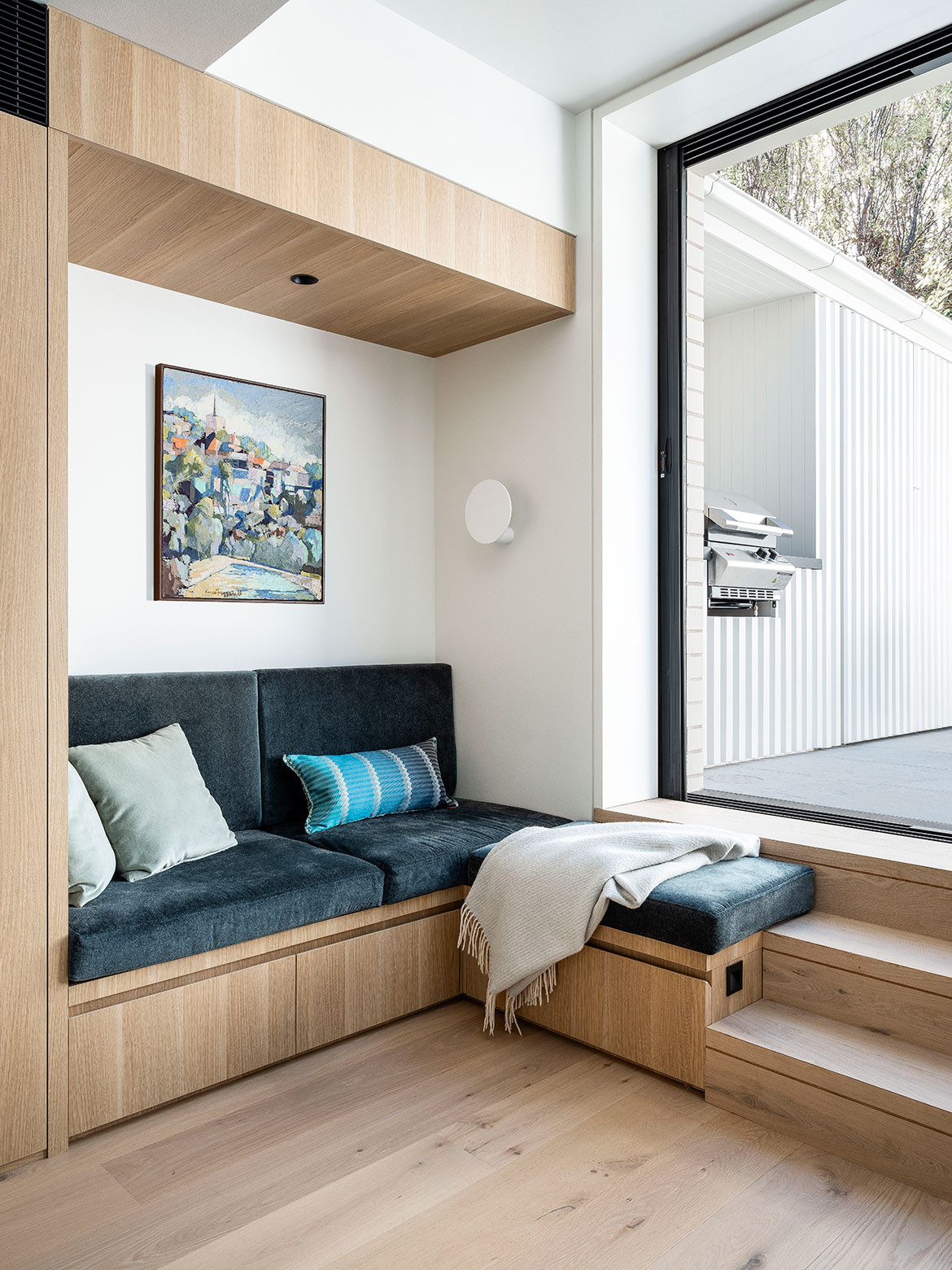 Seating nook with under-bench storage in corner of the kitchen in Paddington Terrace by Porebski Architects