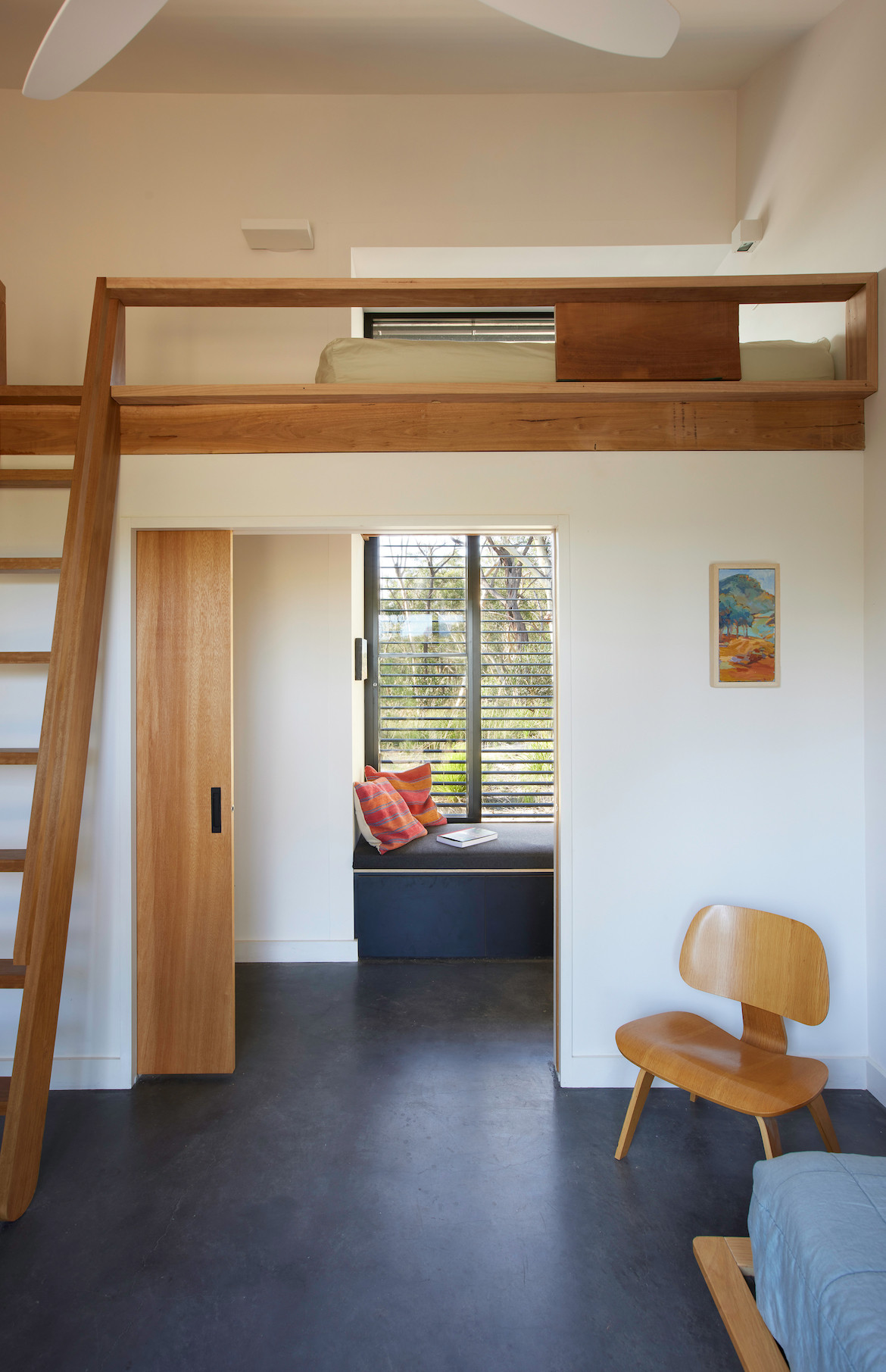 A loft bed inside Off Grid House.