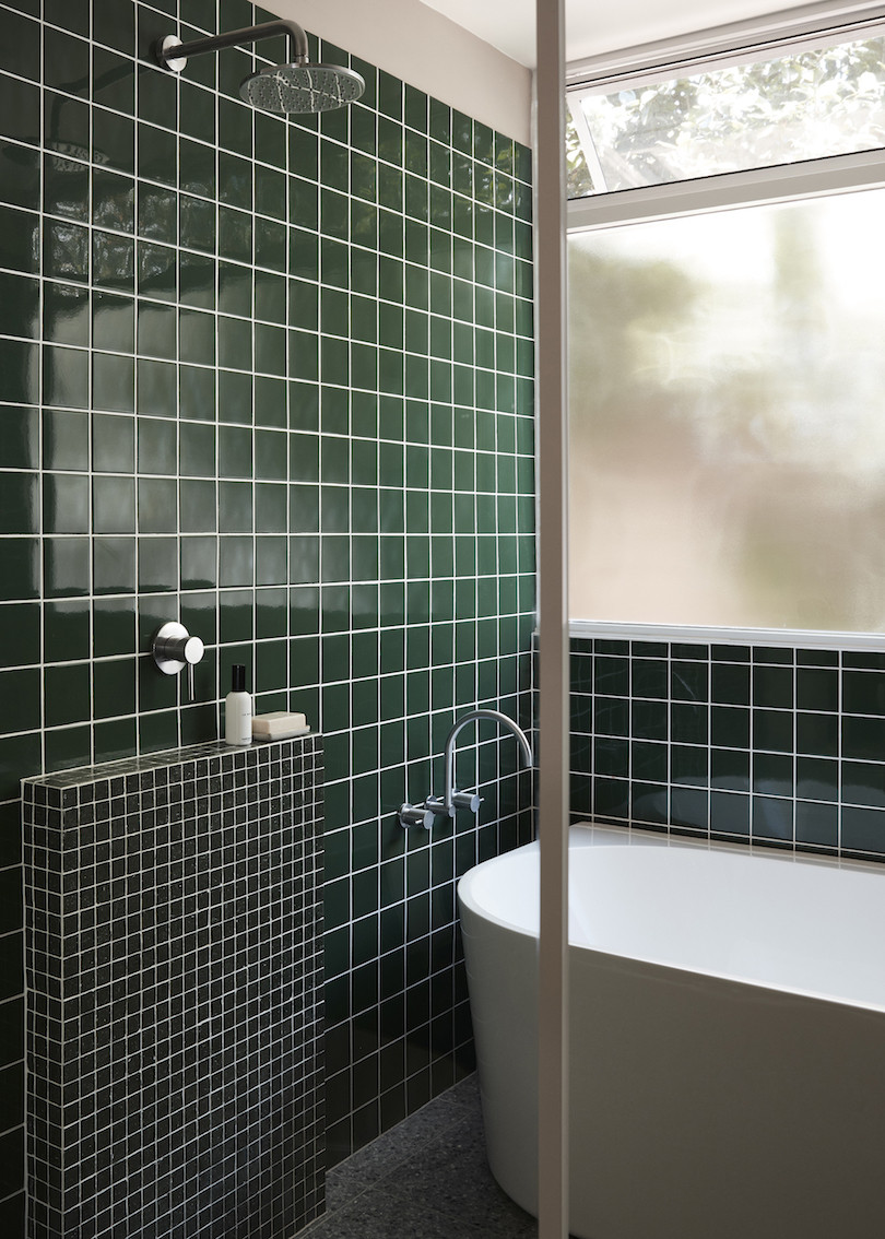 Bathroom with green tiles and white grout in the Wahroonga House by Tom Mark Henry.