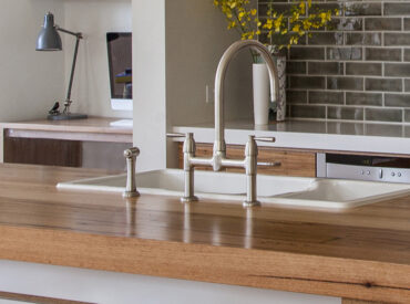 Io kitchen mixer stands between scale and balance