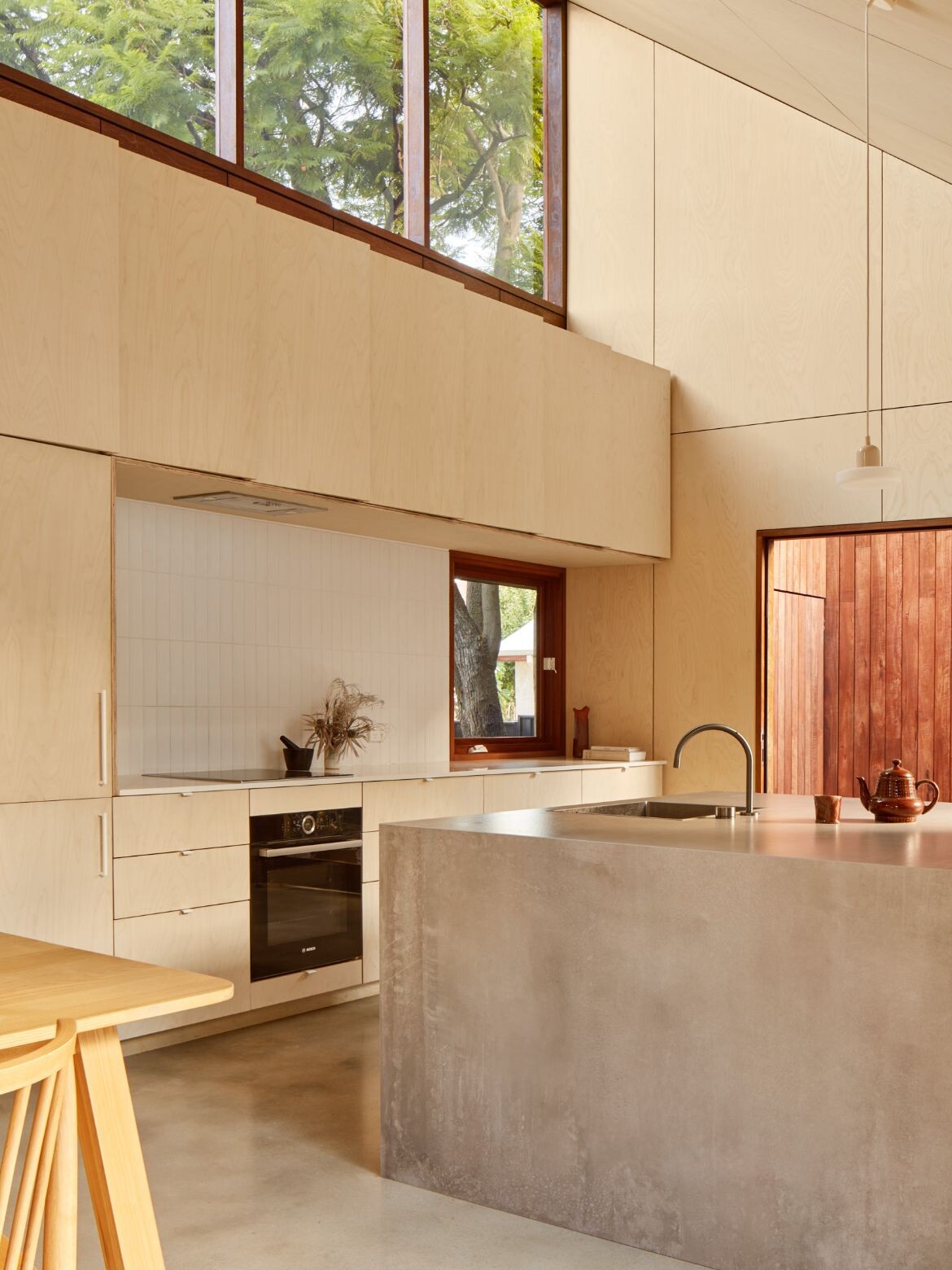 A very light kitchen with white-washed plywood