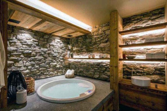 stone natural raw log cabin rustic bathroom