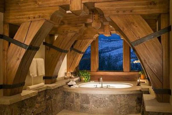 stone bathtub natural raw log cabin rustic bathroom