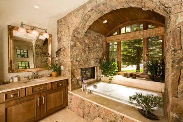 stone bathtub natural raw log cabin rustic bathroom