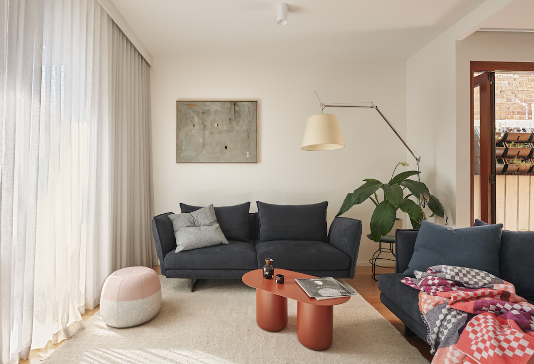 Navy blue lounge chairs in the living room of the Brunswick home.