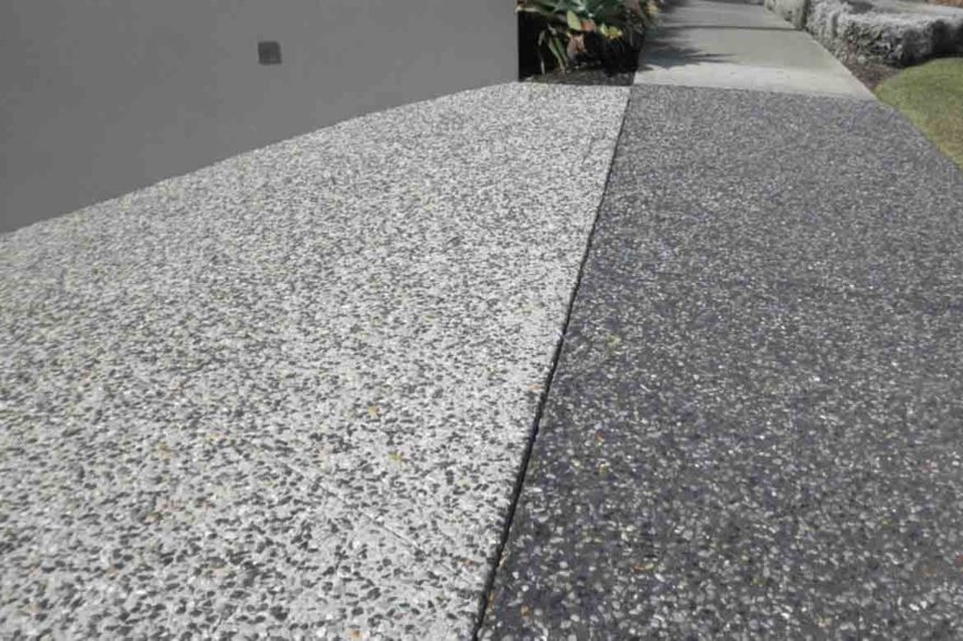 grey and black exposed aggregate concrete driveway