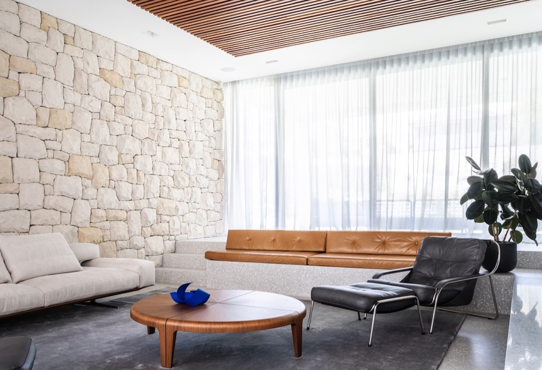 Living room with stone wall