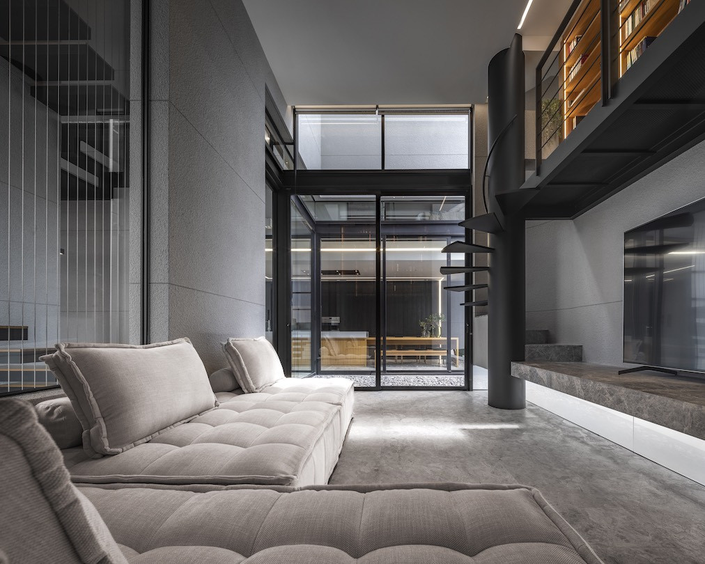 The living room with grey couches and black steel in 55 Sathorn.