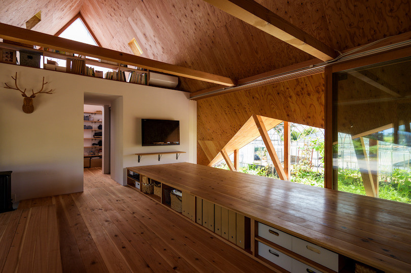 A raised wooden platform in Hara House has storage underneath.