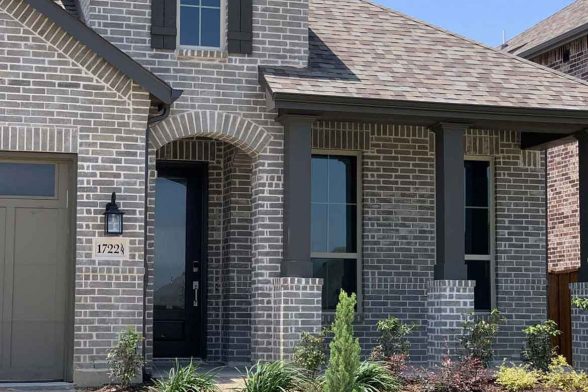 grey brick house exterior white trim joints