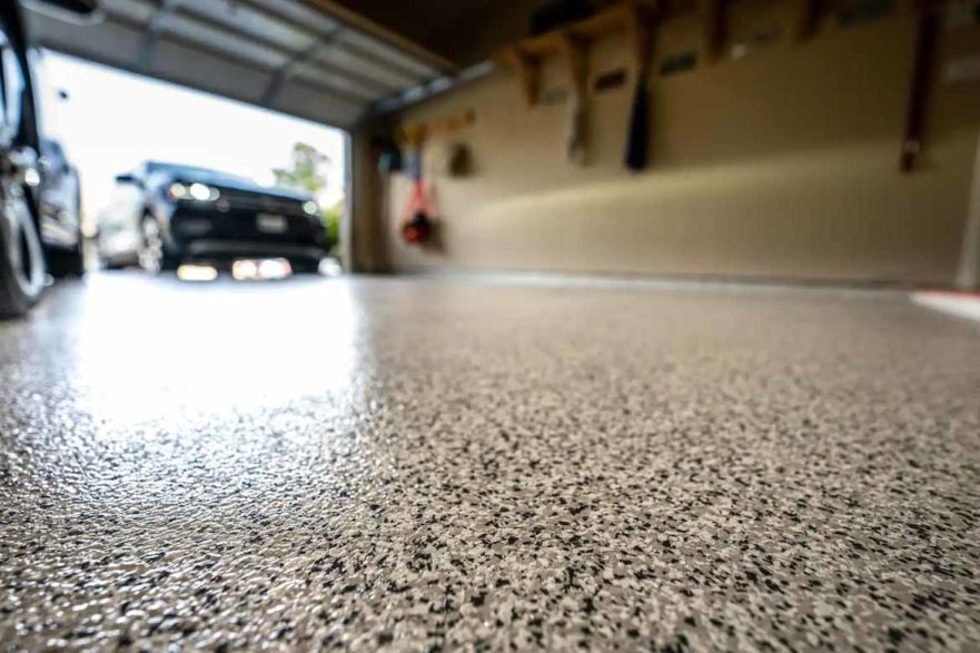 polished concrete epoxy flooring in garage high resin with car