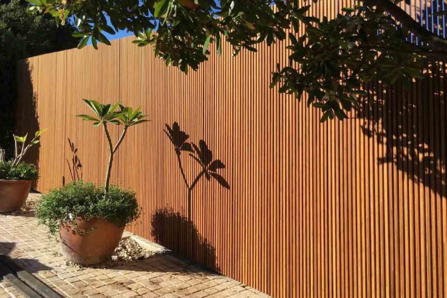 vertical timber fence slats layered overlapping Japanese style garden fence
