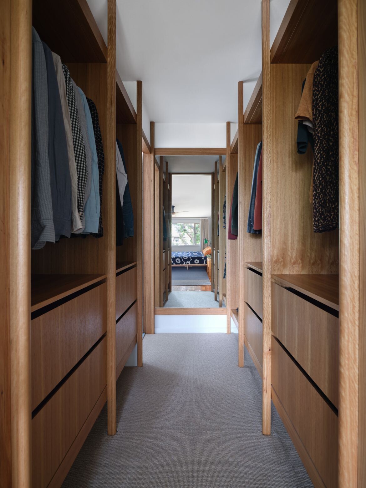 A big walk-in robe features carpet underfoot