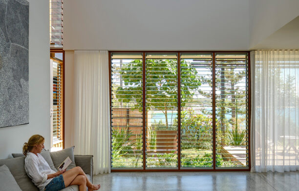 Breezway glass louvre windows maximise ventilation in Bundeena Beach House by Grove Architects