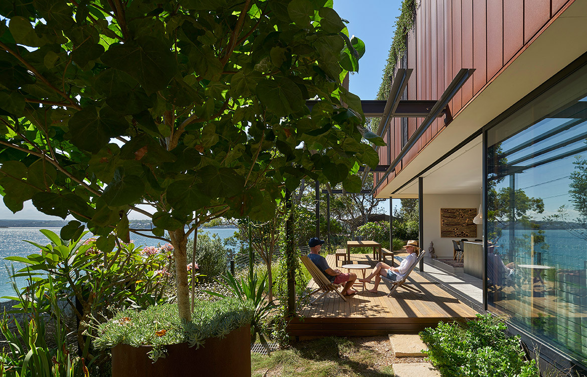 The Corten-clad and timber-clad structures of Bundeena Beach House by Grove Architects form a durable house, well-connected with its environment.