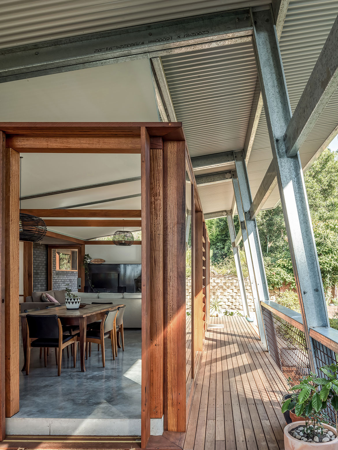 Studio Takt added a north facing living pavilion to a dark, cramped 1950s brick bungalow in Illawarra, NSW, to open Exoskeleton House up to the northerly aspect and connect it to its landscape.