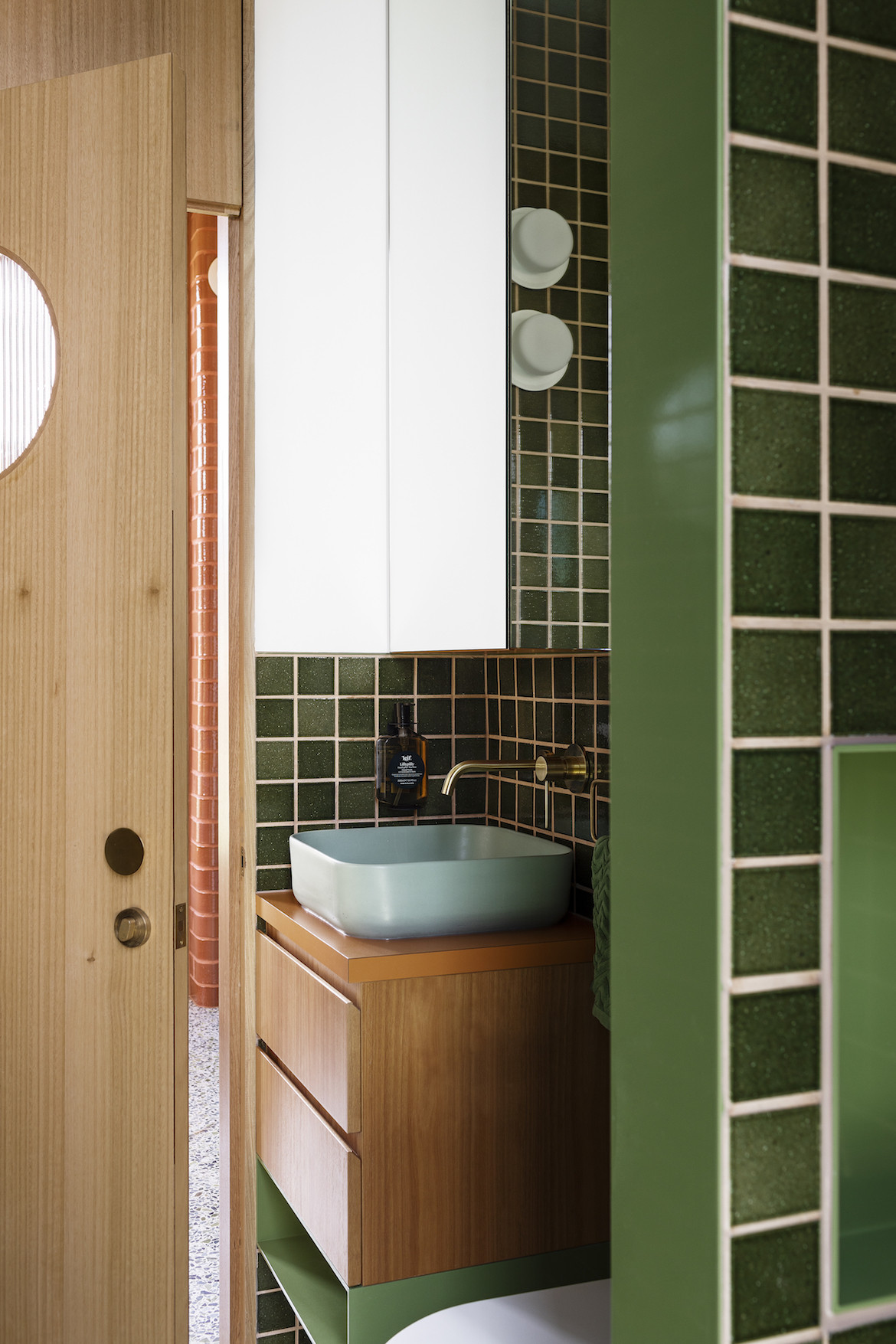 Green tiled bathroom.