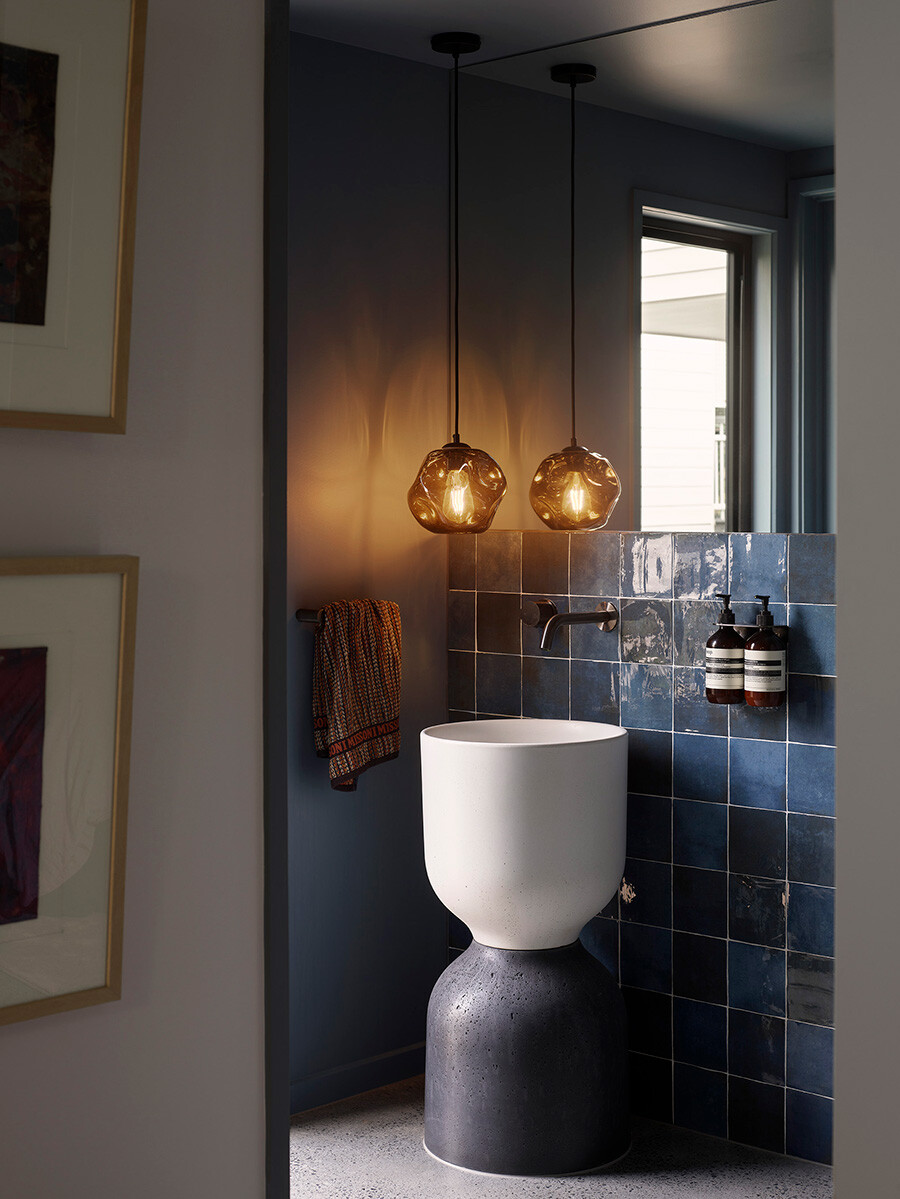 The client's spent time sourcing exactly what they wanted as statement pieces, including the blue tiles in the bathroom