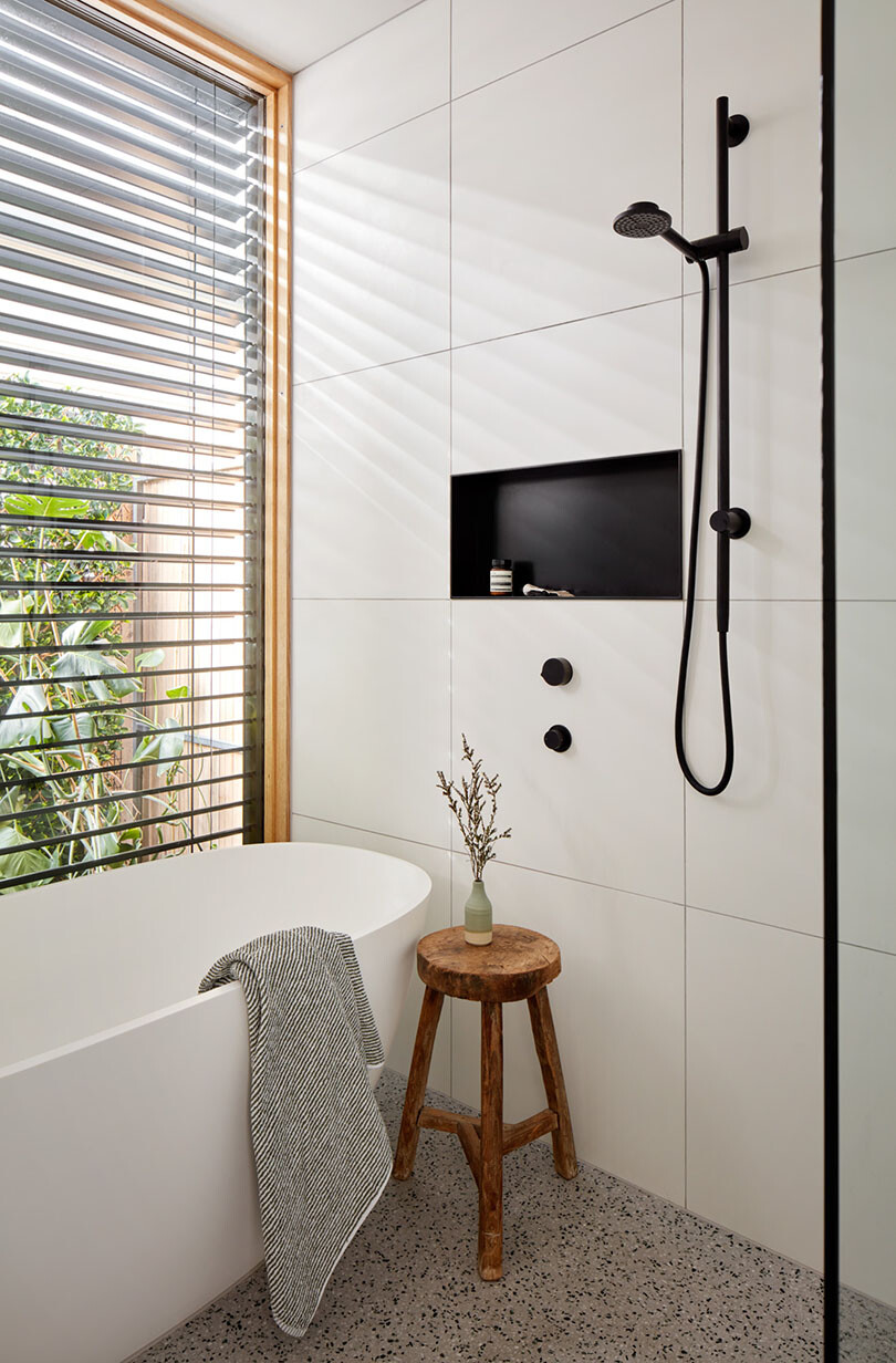 The bathroom looks out to an internal courtyard space