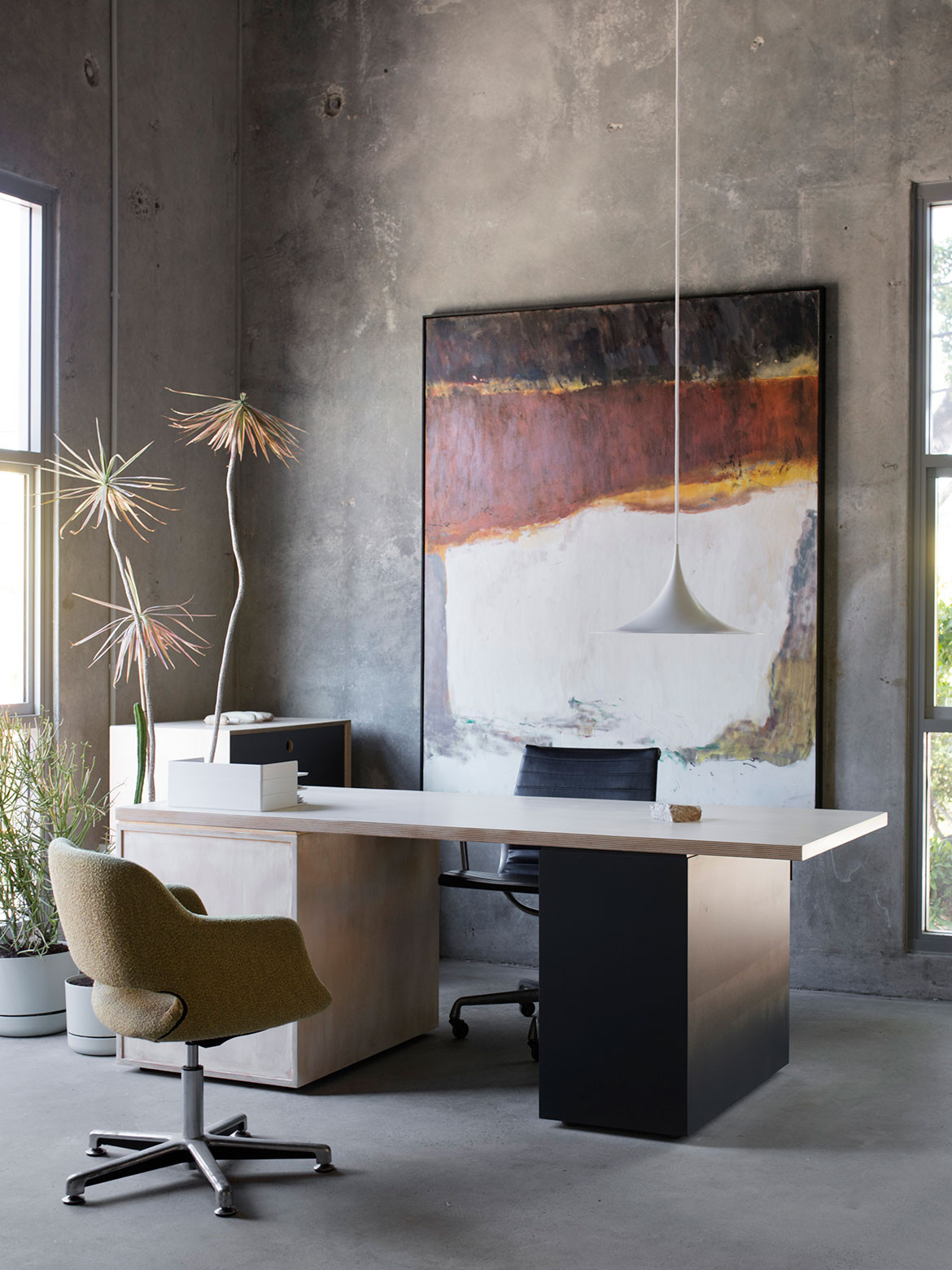 Rendered concrete walls give this Marrickville Warehouse conversion by Adele McNab a minimalist, industrial aesthetic.