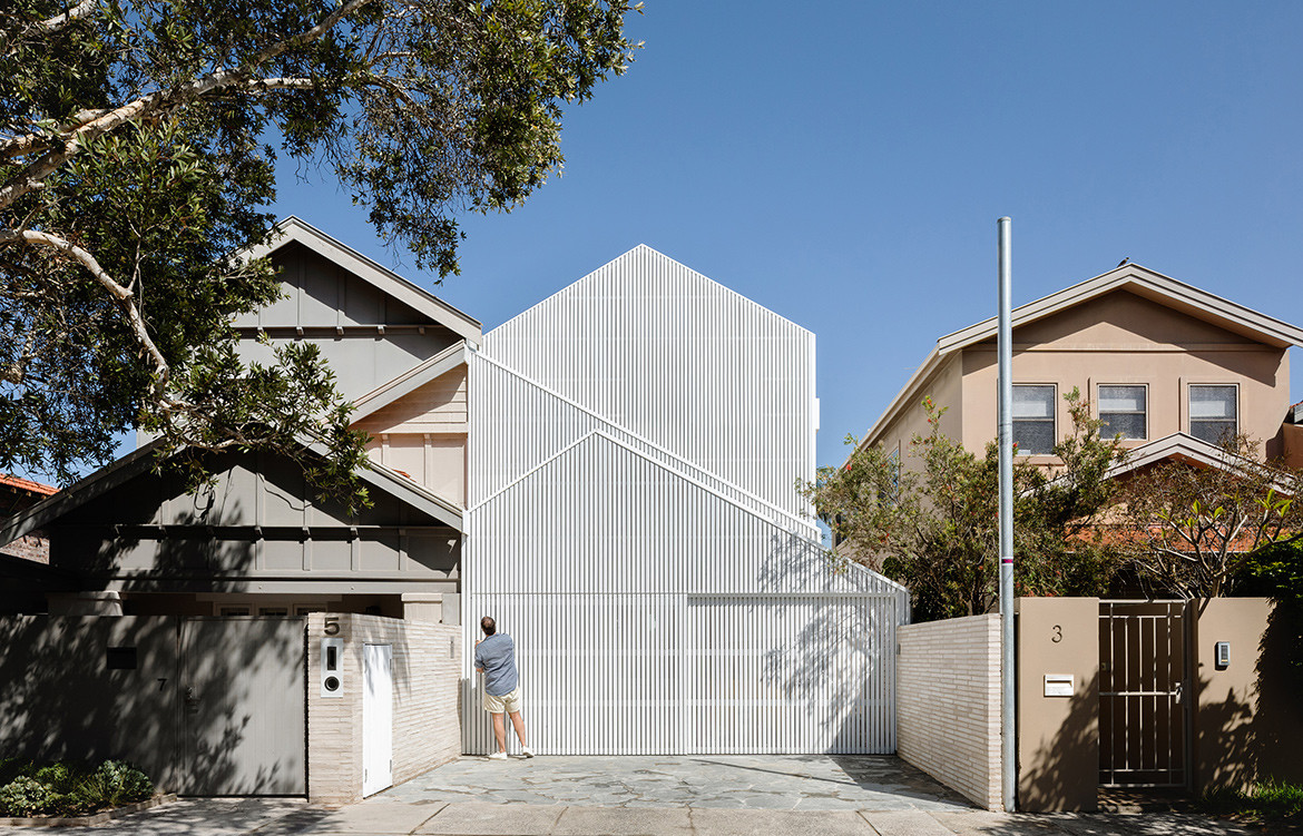 A bungalow in Bondi renovated by James Garvan Architecture into a modern minimalist house with a impressive facade