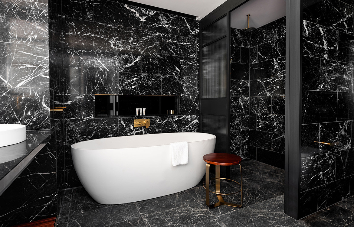 QT Hotel Perth Indyk Architecture bathtub black marble tiles ensuite