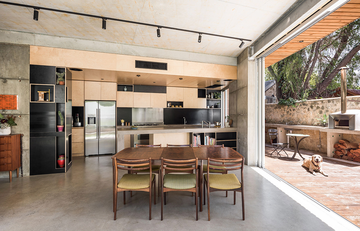 Silver Street House EHDO Architecture CC Dion Robeson dining kitchen and exterior fireplace