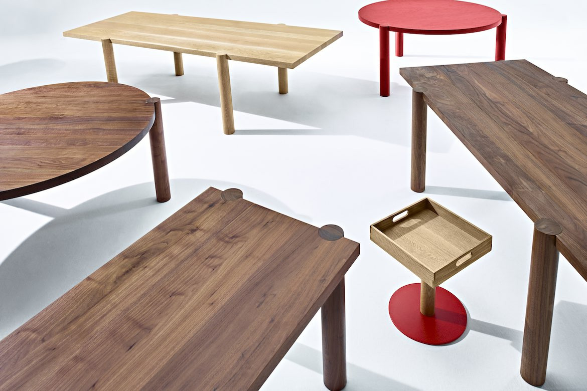 An array of timber tables with cylindrical legs from the Skupa range.