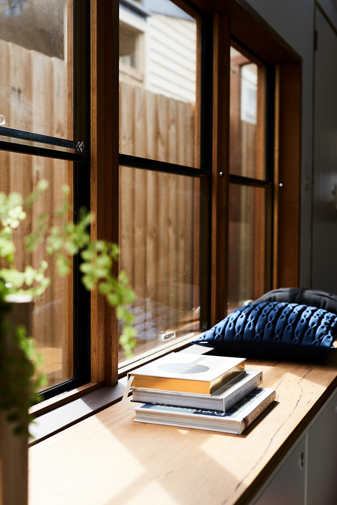 Split End House Mártires Doyle CC Jonathon Griggs custom timber shelving and window in living space