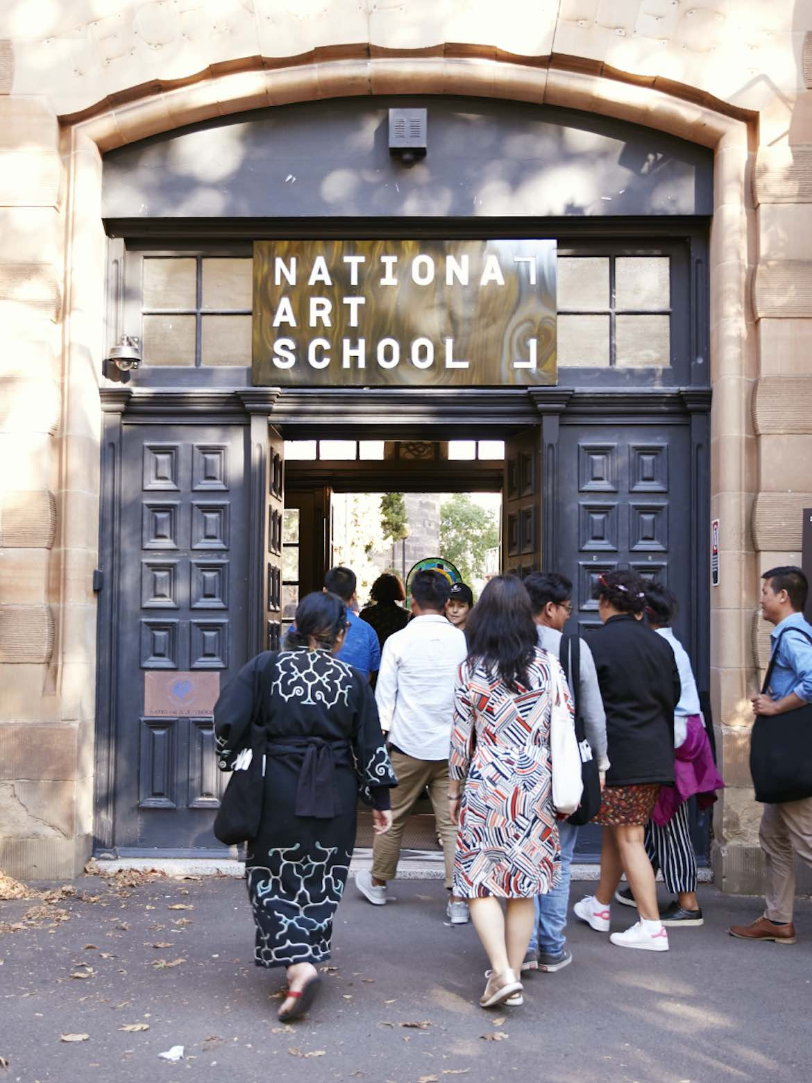 People walk into the National Art School during the Biennale of Sydney 2021